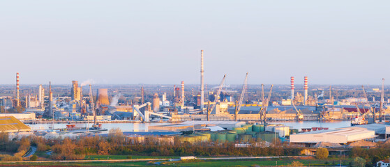 Aerial view of the industrial and port area of Ravenna ,chemical and petrochemical pole,thermoelectric,metallurgical plants and hydrocarbon refinery and liquefied natural gas tanks