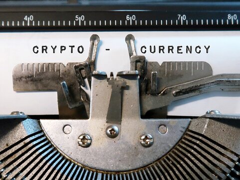 Vintage typewriter with typed text CRYPTOCURRENCY, refer to any form of currency that exists digitally or virtually and uses cryptography to secure transactions