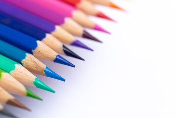 Colored pencils arranged beautifully by color. Taken at a close distance Isolated on a white...