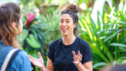 Female coach leads a garden workshop on sustainable living.