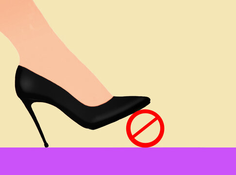 Women foot wearing high heel and stepping on forbidden sign