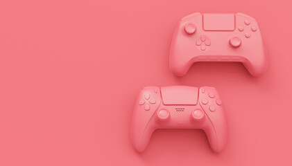Video game joysticks or gamepads in plain monochrome pink color background