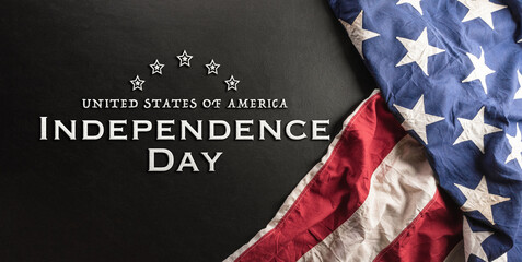 Happy Independence day concept made from American flag on dark wooden background.