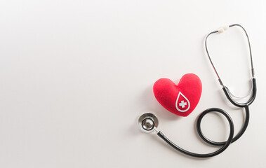 World blood donor day, red cross and nurse day concept made from red heart and stethoscope on white...