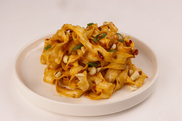 Spicy Sichuan Peanut Noodles Garnish with Peanuts.