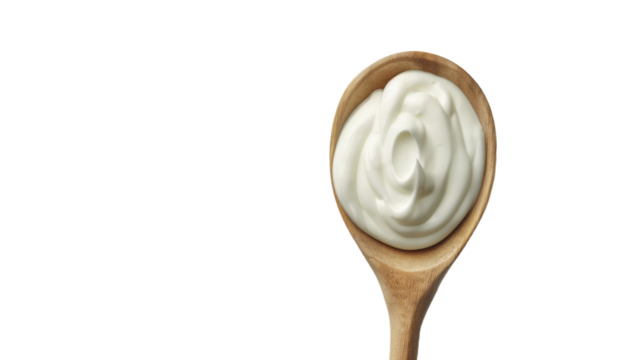 Creamy Delight: A Wooden Spoon Overflowing With White Indulgence