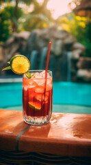 Closeup cocktail drink on the stone next to pool side with space for copy