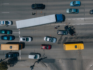 A truck and a car collided on the highway. Serious accident. Traffic accidents on the road. View...