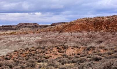looking out over the  colorful badlands  near the visitor center in petrified forest national park, arizona, on a stormy winter day