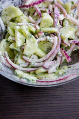 Refreshing Cucumber Salad with Red Onion and Yogurt Dressing