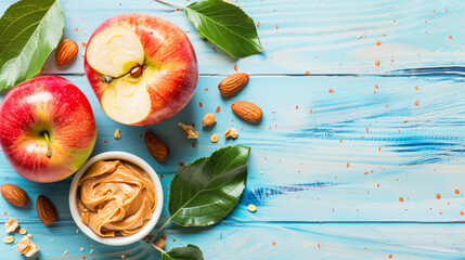 Fresh red apple with peanut butter and nuts on light background