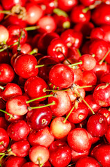 organically grown ripe red cherries, spring fruit texture background
