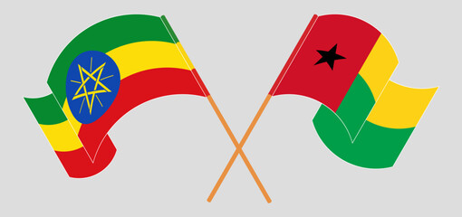 Crossed and waving flags of Guinea-Bissau and Ethiopia