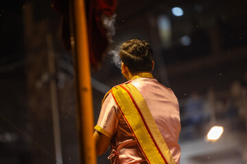 Ganga aarti, Portrait of young priest performing holy river ganges evening aarti at dashashwamedh...
