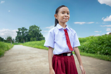 Portrait of an Asian elementary school student girl in uniform going to school