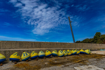 Winning the lottery colorful buoys with numbers and letters on the seashore