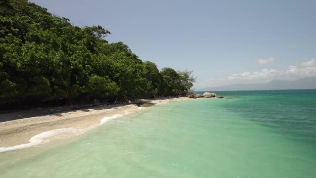 Aerial view of Nudey Beach with turquoise water and lush greenery, Fitzroy Island, Queensland, Australia.