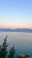 Sunrise overlooking the sea and the old ruins of the city