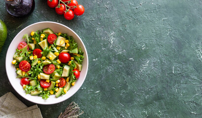 Salad with avocado, tomatoes and corn. Healthy eating. Vegetarian food.