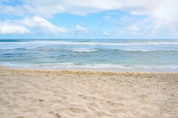 Sandy beach with the blue ocean