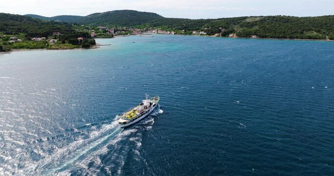 Traveling Jadrolinija Ferry Boat On Dalmatian Coast Towards Zlarin Island Near Sibenik In Croatia. Aerial Drone Shot
