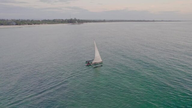 Aerial view of serene sail boat on the Indian Ocean, Diani, Kenya.
