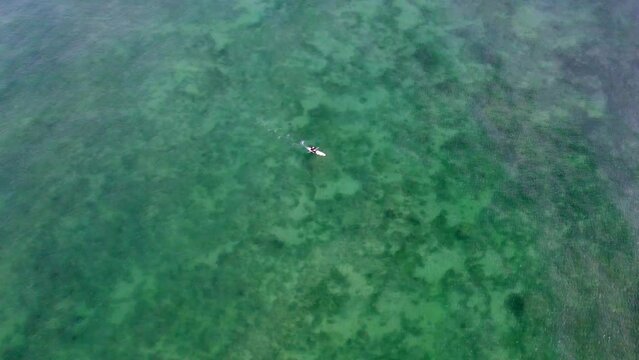 Aerial view of tranquil kayak adventure in clear blue waters of Indian Ocean, Diani, Kenya.