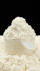 White protein, whey powder in cup. Bodybuilding, fitness and gym lifestyle