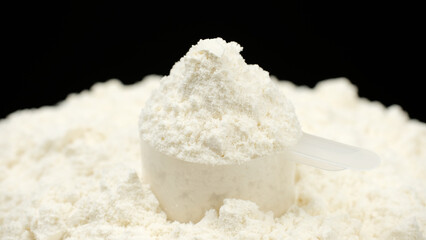 White protein powder whey in cup. Bodybuilding, fitness and gym lifestyle