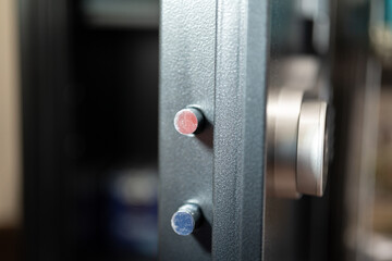 A safety box with heavy-thick steel door is opening , close-up and selective focus. Financial security robbery scene concept.