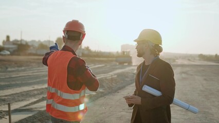 Supervisor and director at construction site outside