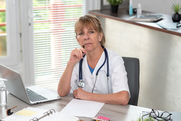 Portrait of thoughtful female doctor