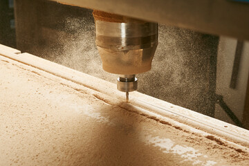 CNC milling machine. Machine tool in wood factory with drilling machines.