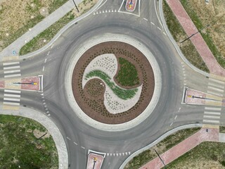 Aerial view of a traffic roundabout, showing the junction of multiple roads
