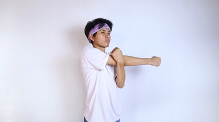 young men in white shirts warming up their hands and arms