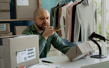 Small business startup. The store owner communicates with the client about the readiness of the...