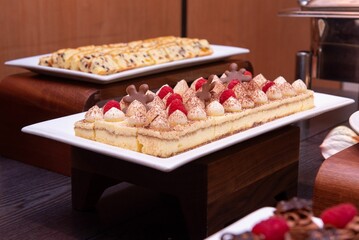 Closeup of delicious Christmas cakes at a banquet