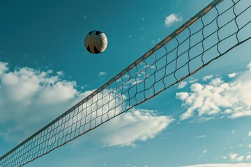 High-Flying Volleyball Over Net Against Blue Sky: Sport, Competition, Dynamic