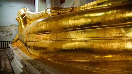 Reclining Buddha at Wat Thammikarat It is a twelve meter long bed built by King Trailokkanatha of the early Ayutthaya period.
