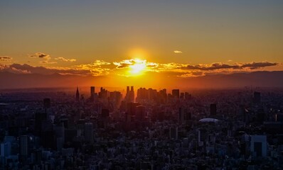 Beautiful sunset view of a city skyline, illuminated by the sun