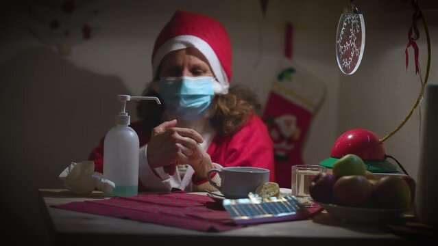 Woman Santa in Costume in Bed with Flue - Facial Mask and Disinfection - Quarantine Concept