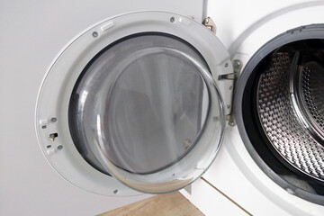 Modern Front-Loading Washing Machine with Open Door for Home Laundry Use - Efficient and Convenient Appliance Design