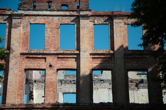 Old abandoned building  against blue sky.
