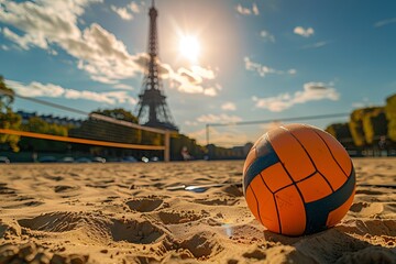 Close-up of an orange volleyball on sandy court in Paris, with Eiffel Tower in the background,...