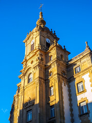 Clock tower of Corazon de Maria Church on a blue sky. San Sebastian, Gipuzkoa, Basque country,...