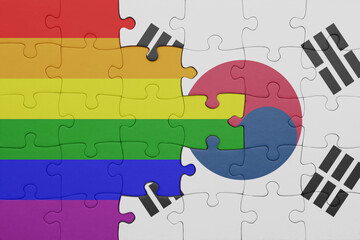 puzzle with the colourful national flag of south korea and rainbow gay pride flag .