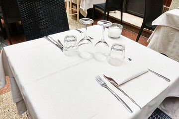 Elegant Restaurant Table Setting with Wine Glasses and Cutlery for Fine Dining