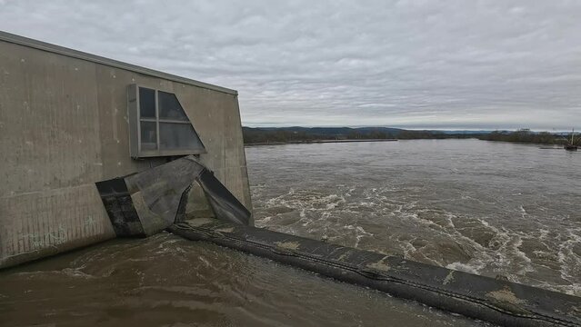 Water of the Danube river flowing through the gates of the hydroelectric power station, Germany