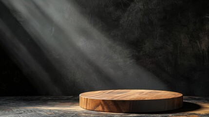 Fototapeta premium A wooden platform with a spotlight shining on it, set against a dark background. Perfect for showcasing products or creating a dramatic mood.