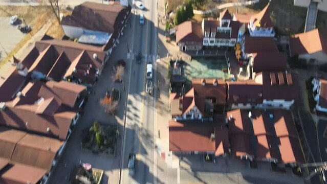 Aerial view of the Helen town houses with trees and cars on the street in Georgia, USA during autumn